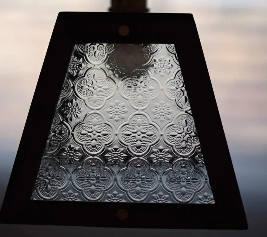 Dark wood and glass led pendant lamp with a black-framed embossed quatrefoil glass panel for dining room