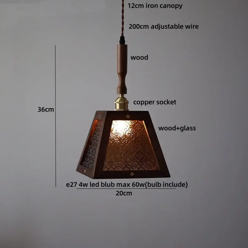 A warm-toned dark wood and amber glass led pendant lamp for dining room with pyramid-shaped design