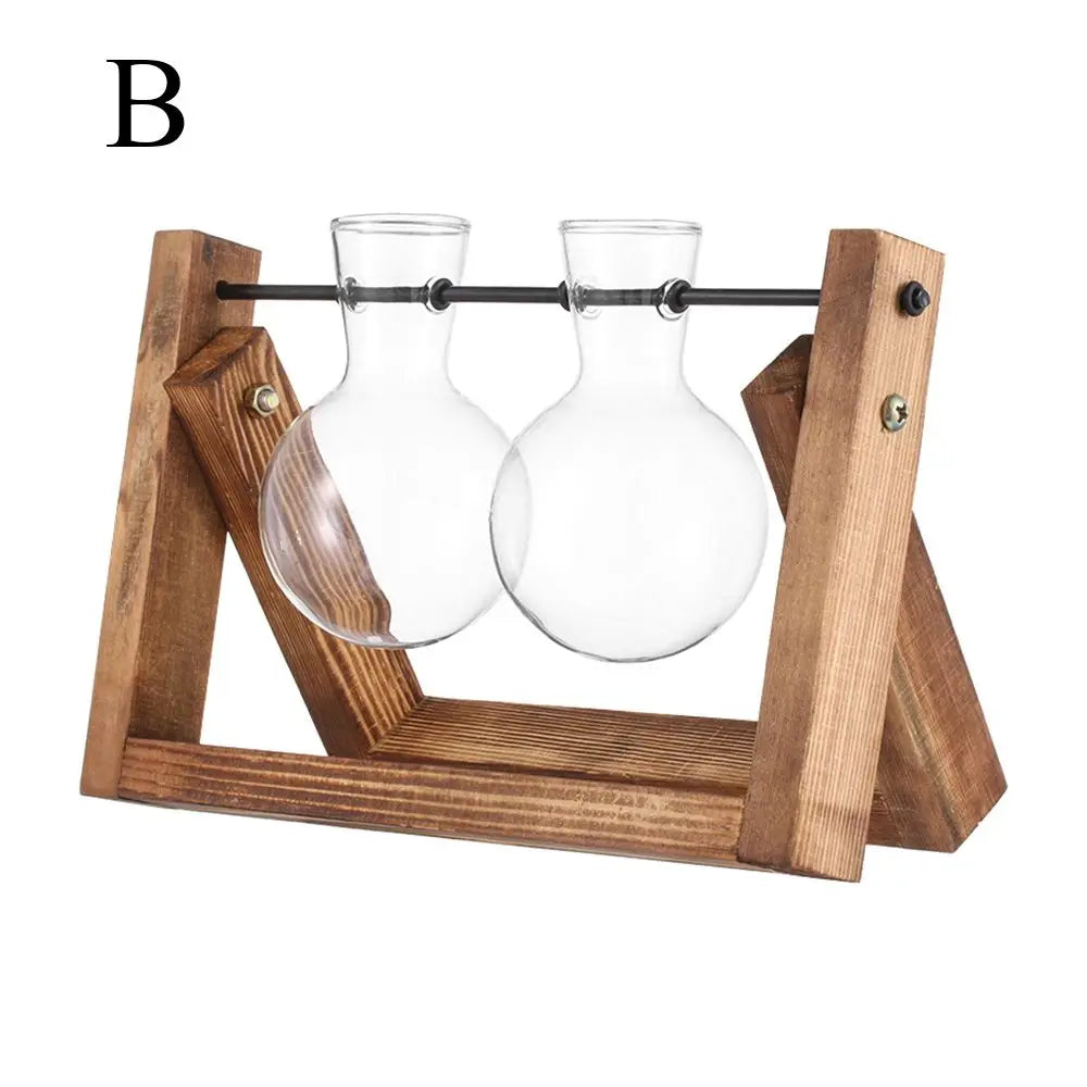 Clear glass bud vases with rounded globes and narrow necks on a rustic wooden stand for tabletop hydroponic plants