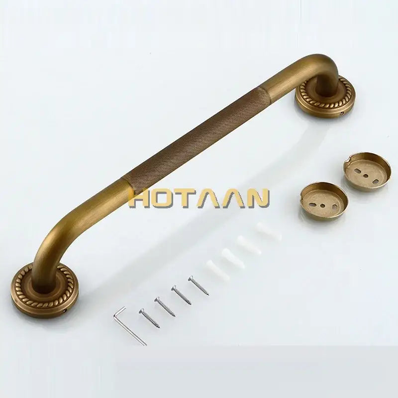 Decorative brass bathroom safety grab bar with rope detail textured grip and ornate circular end caps for toilet use