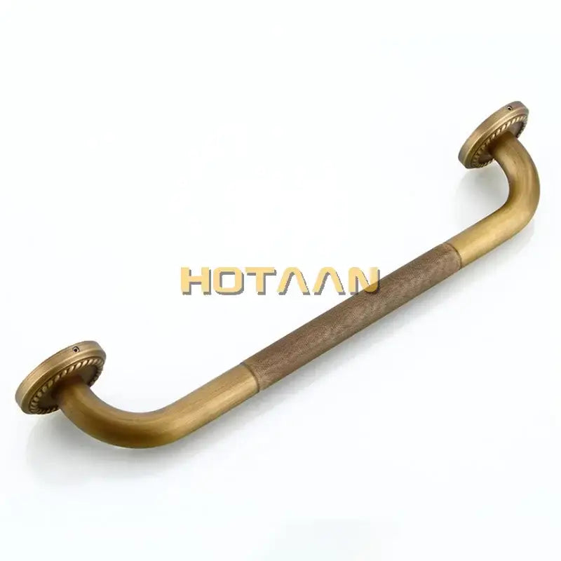 Decorative brass bathroom safety grab bar with rope detail and textured grip for enhanced safety next to toilet