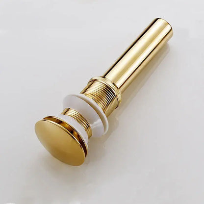 Decorbites brass bathroom pop-up drain with gold-toned cylindrical design and white ceramic base for bathroom sink decor