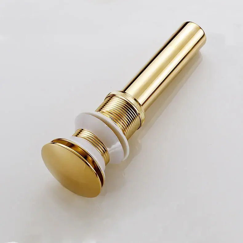 Decorbites brass bathroom pop-up drain with gold-toned cylindrical design and white ceramic base for bathroom sink decor