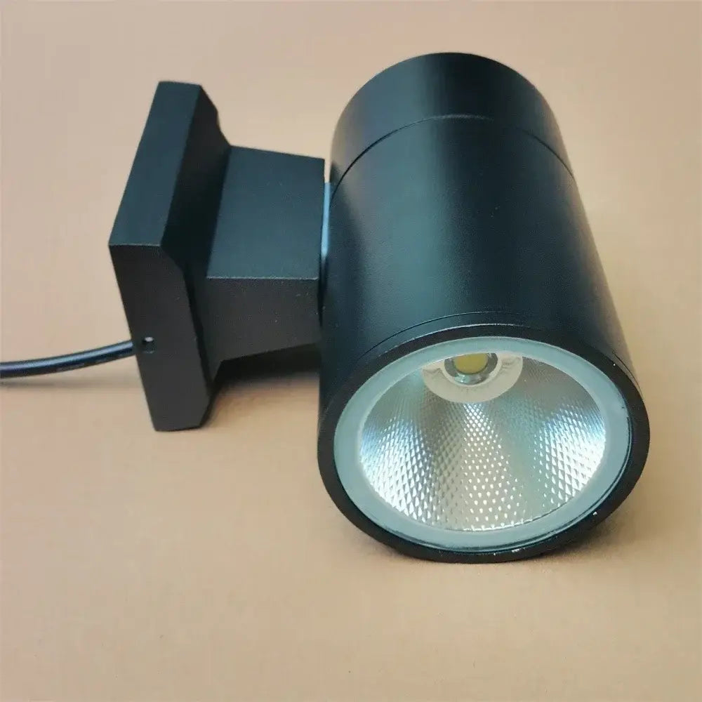 Modern black cylindrical 10w light wall outdoor porch spotlight with matte finish and reflective textured lens