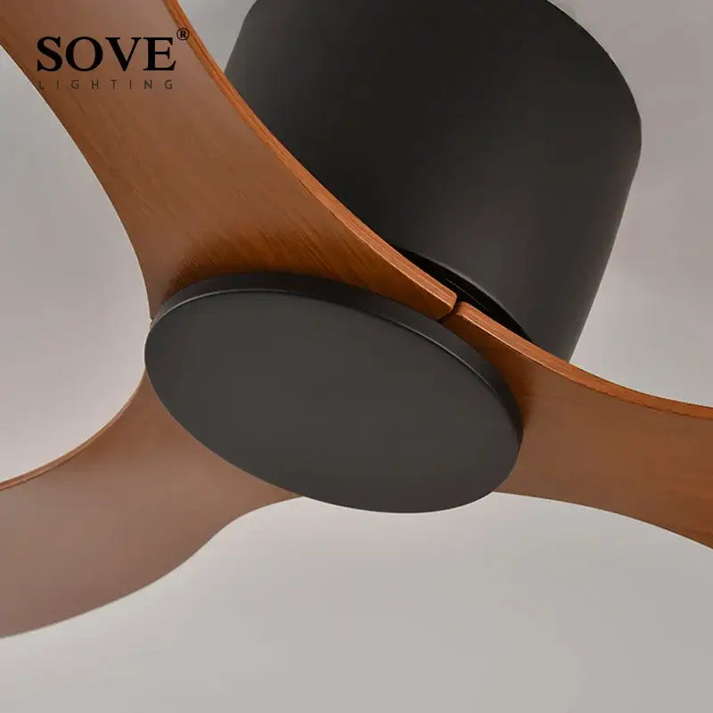 Modern white dc ceiling fan by sove with remote control featuring sleek black and warm wood-toned blades for bedroom use