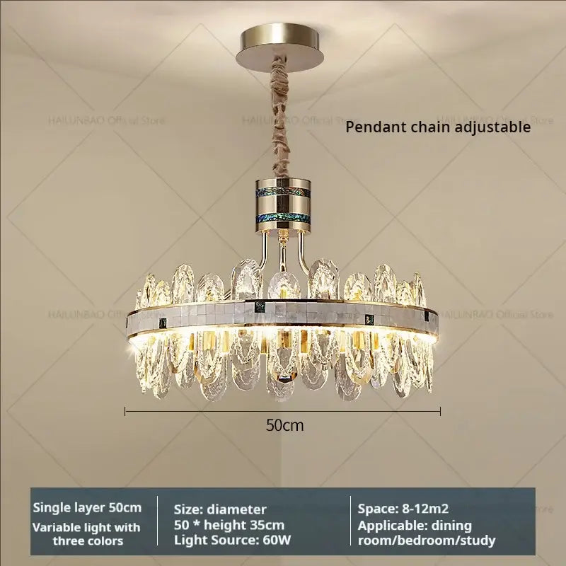 A modern luxury villa crystal chandelier with a metallic frame and clear and green crystal pieces for living room