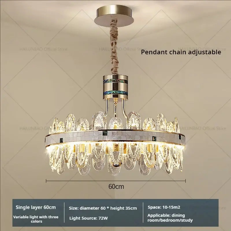 A modern villa crystal chandelier with clear glass droplets and a sleek silver metal frame for living room use