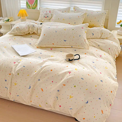 Cream-colored DecorBites summer bedding set with multicolored stars moons and dots for twin and queen sizes