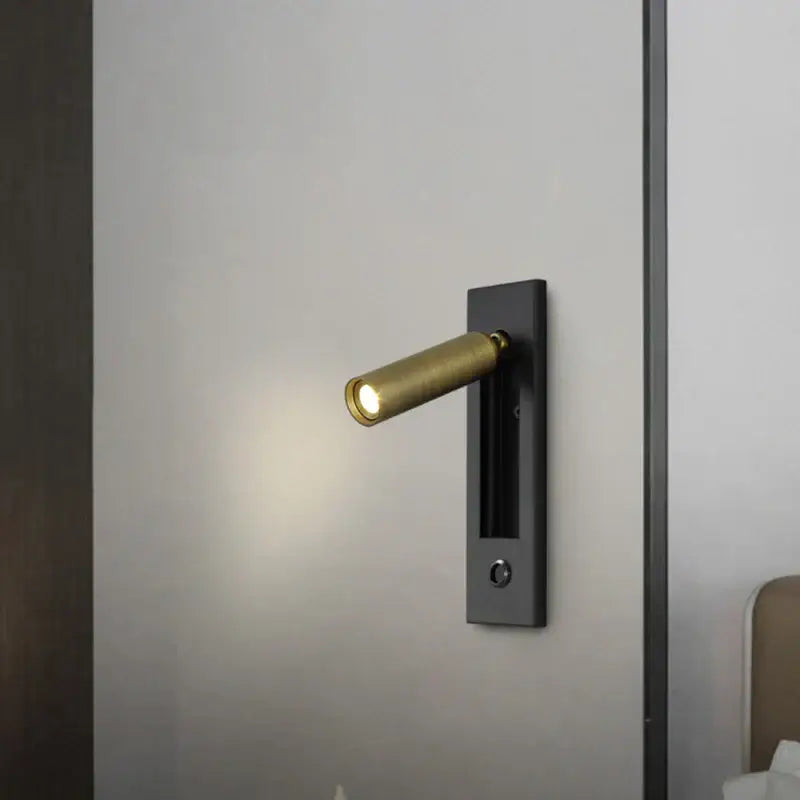 Modern brass and black led mounted headboard wall light with adjustable arm and sleek rectangular base by decorbites 3w led