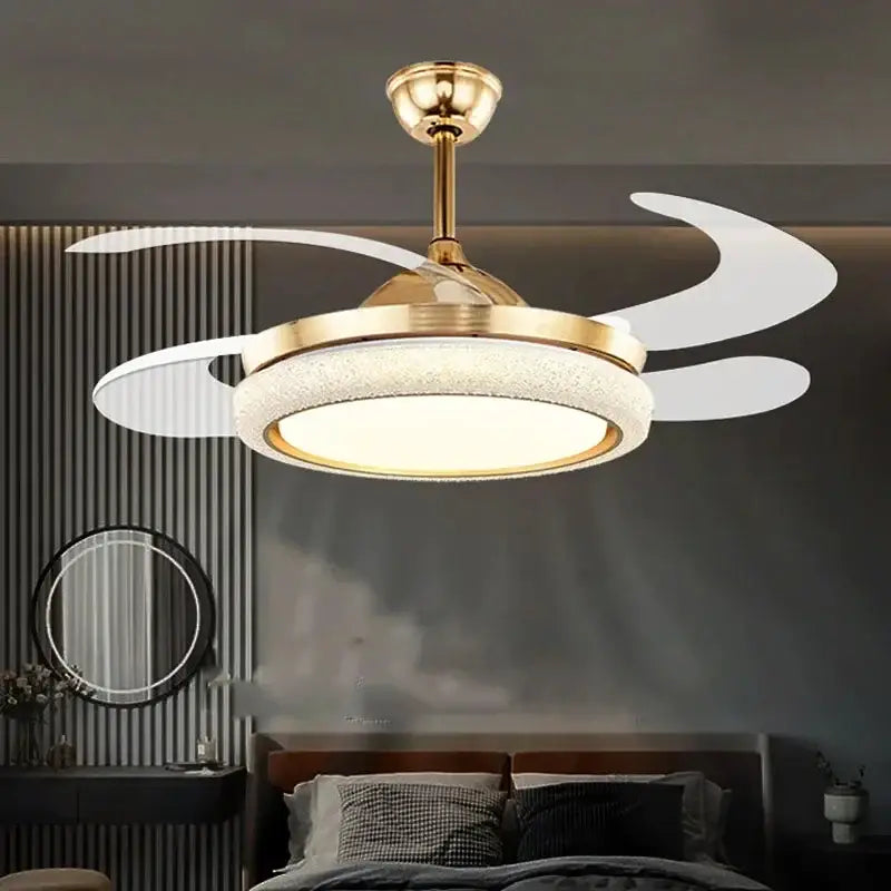 Gold-toned ceiling fan light with integrated LED and sleek curved white blades for modern bedroom use