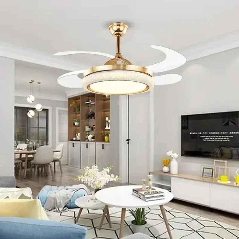 Gold-toned ceiling fan light with white crescent-shaped blades and integrated led light for bedroom use