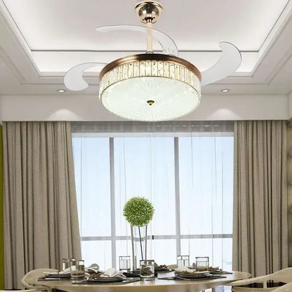 Modern gold ceiling fan with retractable blades and crystal accents featuring integrated lighting and remote control