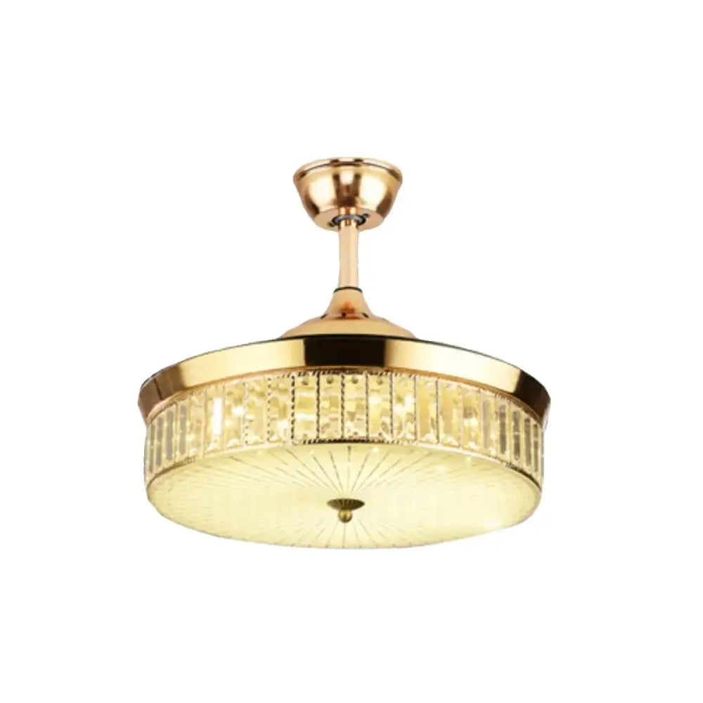 Modern gold ceiling fan with retractable blades and integrated warm light featuring vertical crystal accents