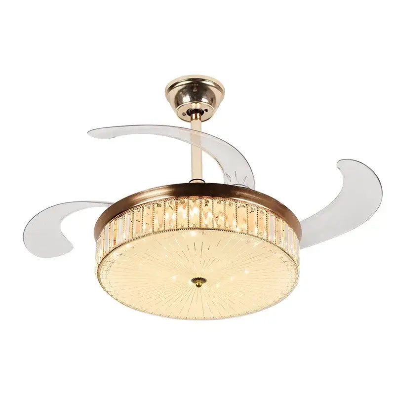 Modern gold crystal ceiling fan with brass motor housing, clear retractable blades, and illuminated light with crystal accents