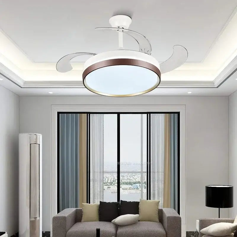 Modern black and white ceiling fan with remote control featuring a sleek white and bronze circular integrated light design