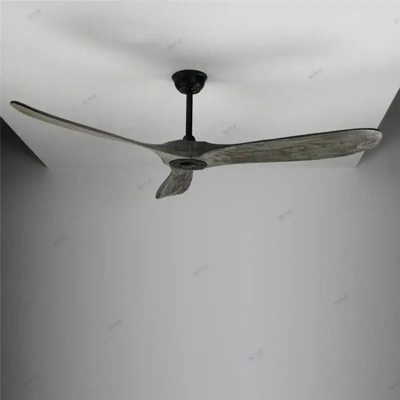 Modern ceiling fan with three wide weathered gray wood blades and sleek black hub for living room wood ceiling use