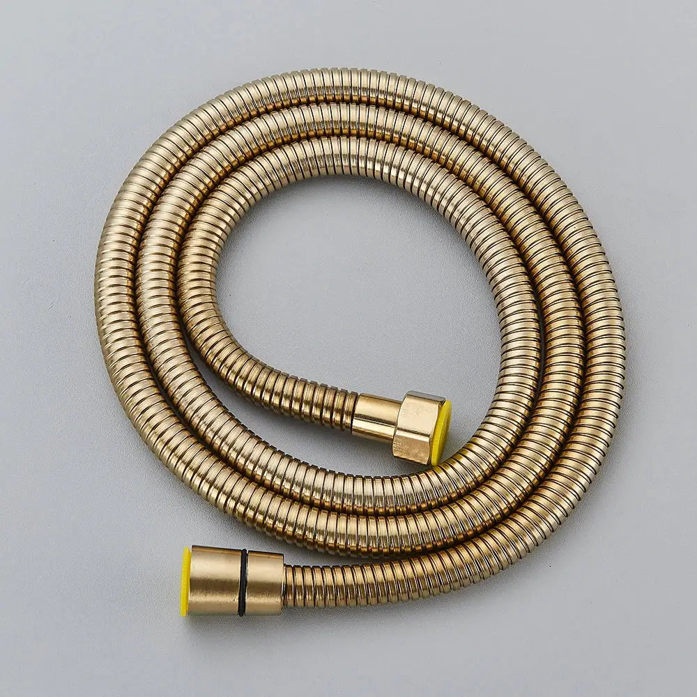 Gold-colored flexible metal shower hose with ribbed texture and yellow caps for decorbites™ black bronze replacement use