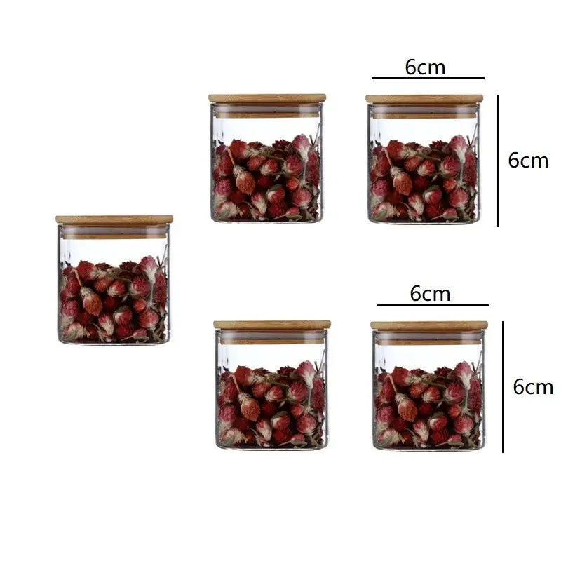 Decorbites 5oz glass jars set with clear glass and bamboo lids filled with dried red flowers for storage