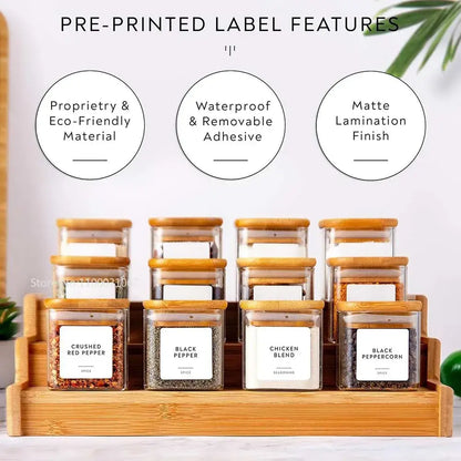 Set of clear decorbites 5oz glass jars with bamboo lids and labels arranged on wooden tray for tea and coffee storage
