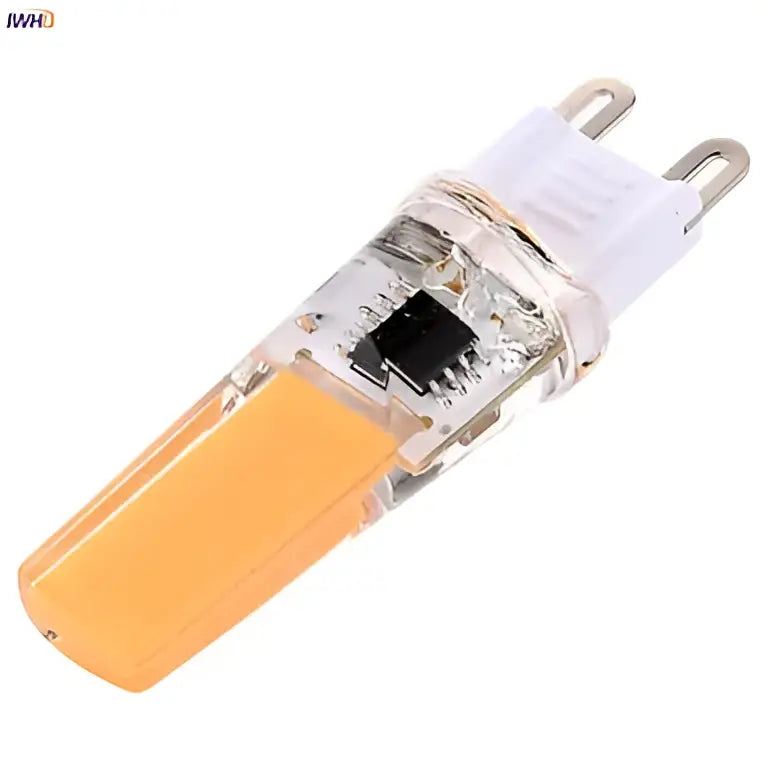 Clear glass decorbites dimmable led g9 bulb with warm yellow-orange glow and white g9 base for indoor lighting