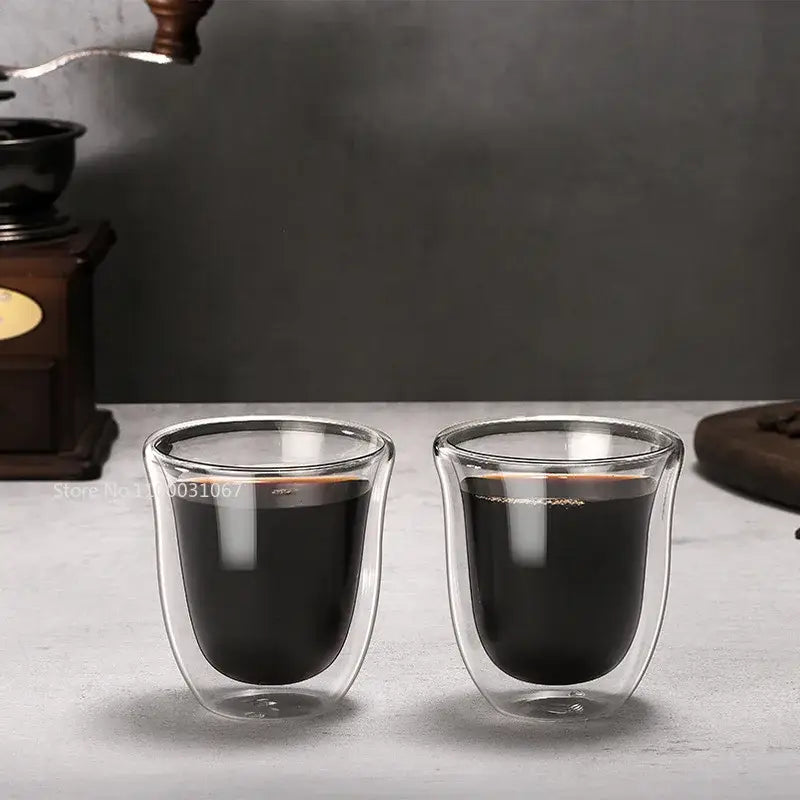 Two clear double wall glass coffee mugs filled with dark liquid from decorbites insulated 150ml set