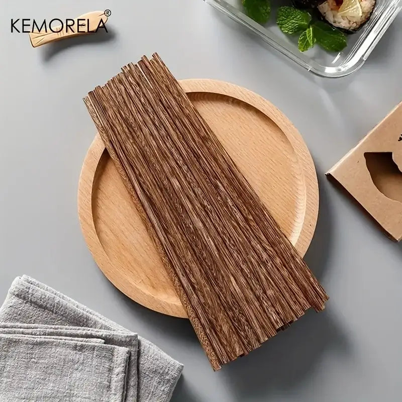 Brown natural wooden chopsticks with a natural grain pattern on a light wood plate enhancing your dining experience