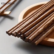 Set of 5 decorbites™ natural wooden chopsticks in light brown on a wooden tray enhancing dining experience