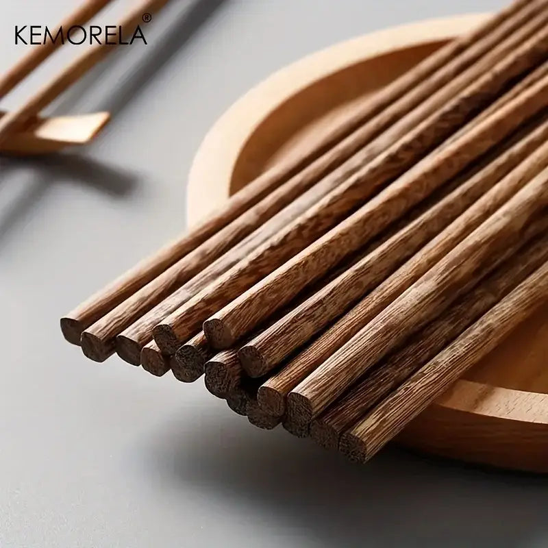 Set of 5 decorbites™ natural wooden chopsticks in light brown on a wooden tray enhancing dining experience
