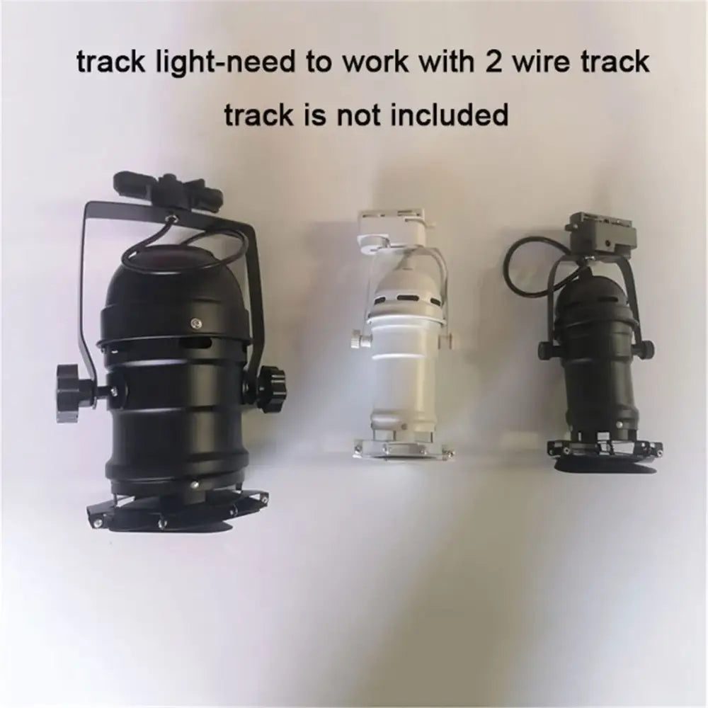Three decorbites™ cob led track lights with adjustable baffle, one black and two silver, for clothing store spotlighting