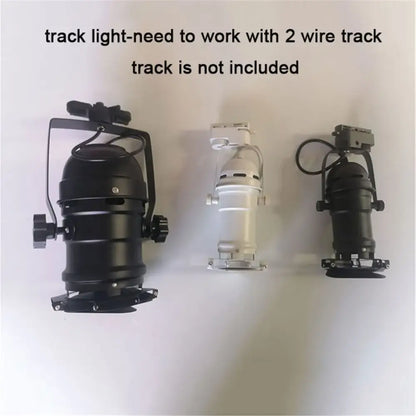 Three decorbites™ cob led track lights with adjustable baffle, one black and two silver, for clothing store spotlighting