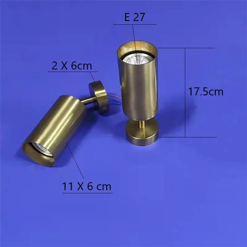 Brass-finished copper led ceiling track downlight with cylindrical adjustable heads and replaceable e27 bulb by decorbites