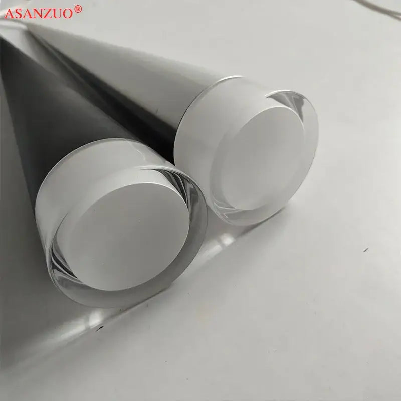 Two sleek glass tubes with polished metallic ends in a silver black aluminum led pendant light for kitchen island