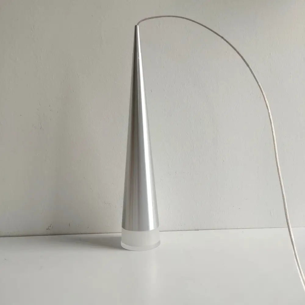 A sleek metallic cone-shaped led pendant light with a curved wire arm and frosted base in silver black aluminum