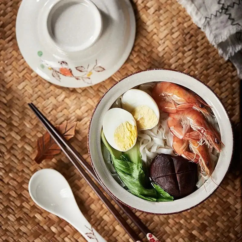White ceramic ramen bowl with brown rim filled with seafood noodles from DecorBites retro ceramic ramen bowl set
