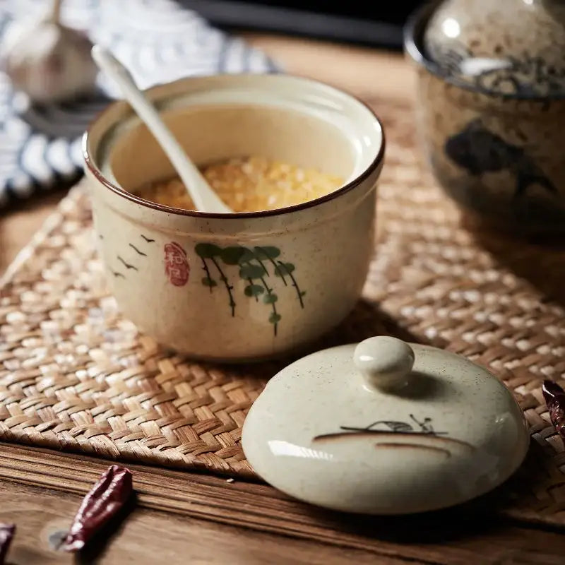Beige retro ceramic ramen bowl set with hand-painted green lotus leaves red seal lid and white spoon inside by decorbites