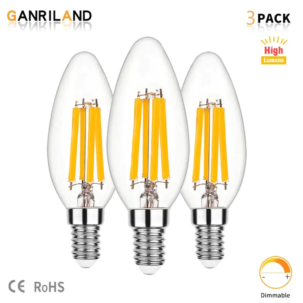 Three clear glass decorbites led bulbs with yellow candle flame effect filament coils and chrome screw bases