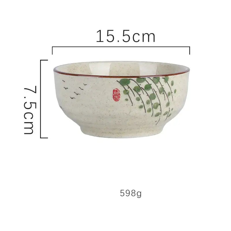 Beige speckled ceramic ramen bowl decorated with green vines and bird silhouettes, featuring a red rim for kitchen use