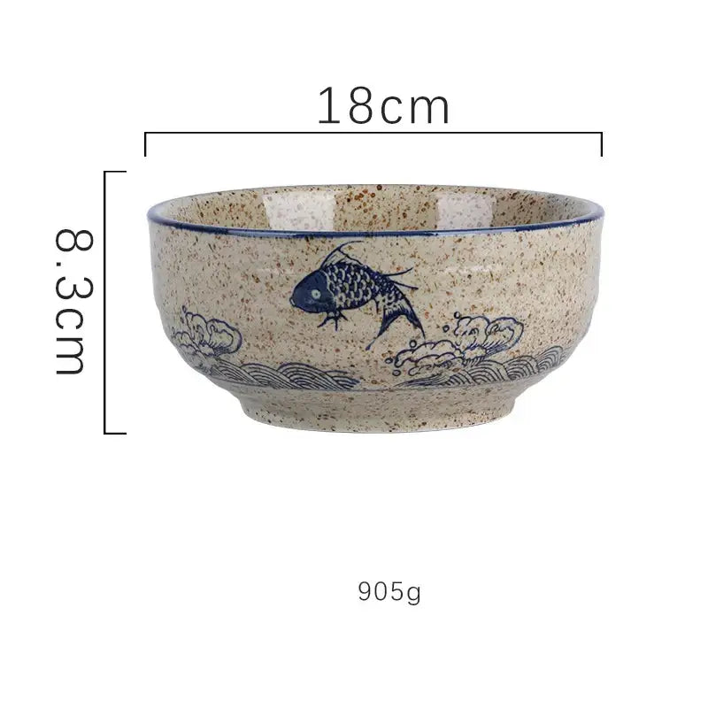 Beige speckled ceramic ramen bowl with blue fish and wave design and dark blue rim for kitchen and hotel use