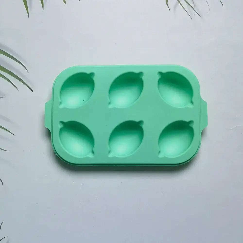Decorbites™ mint green lemon shape silicone cake mold with six cavities and rounded handles for diy baking