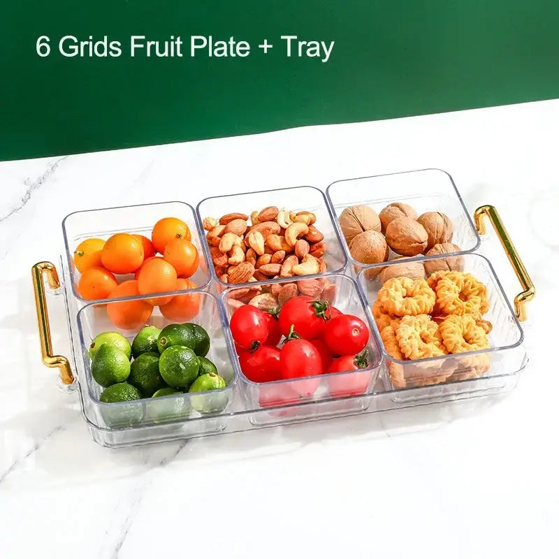 Decorbites™ clear plastic 6-grid divided fruit plate with gold handles holding oranges nuts and cookies
