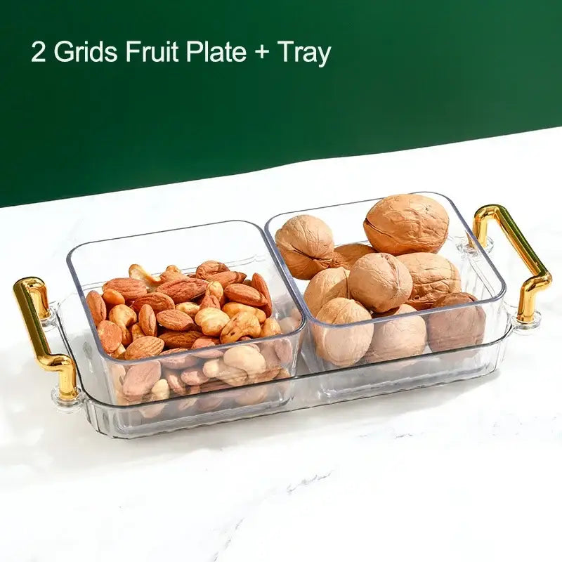 Clear plastic decorbites™ 6-grid divided fruit plate with gold-tone handles holding almonds and walnuts in two compartments