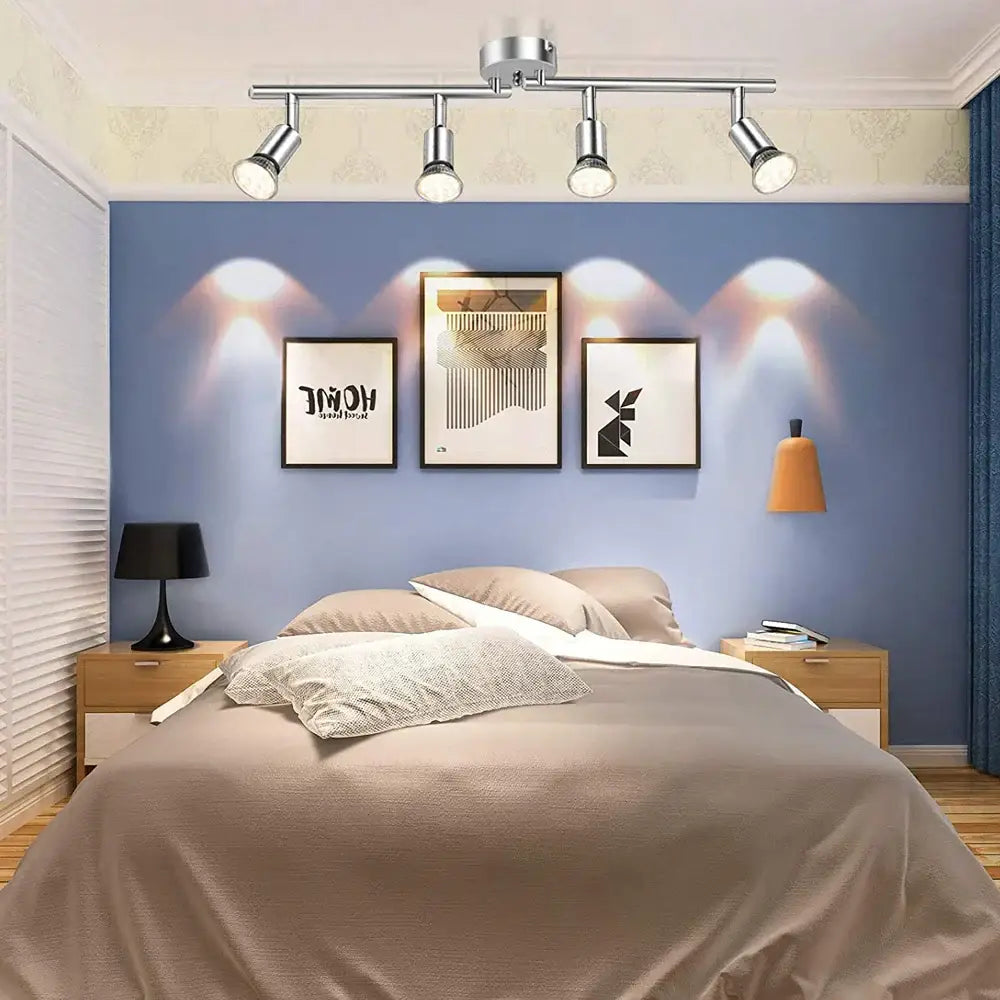 Modern chrome-finished ceiling light with four adjustable angle spot lamps for living room and bedroom lighting