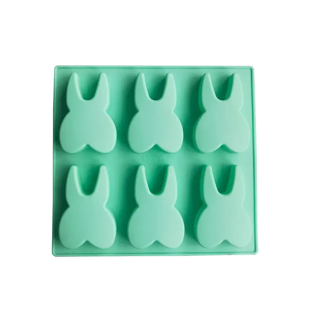 Mint green silicone mold featuring a bunny shape by decorbites™ 6 hole tooth silicone mold for ice cubes and baking