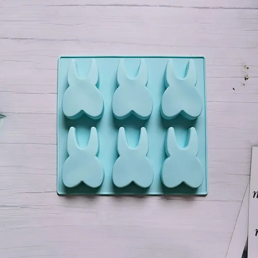 Light blue silicone mold with six bunny-shaped hole tooth silicone cavities for cake biscuit candy ice cube use