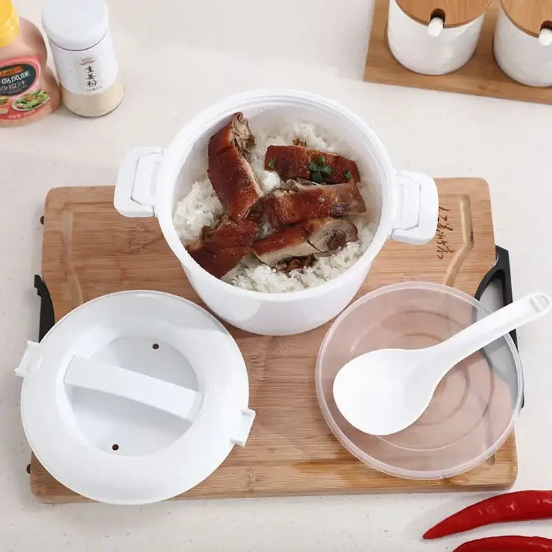 White plastic decorbites™ 6-in-1 cooking pot with handles filled with steamed rice and sliced roasted pork