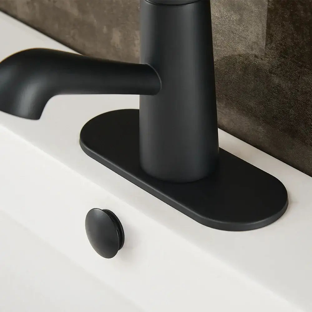 Black matte bathroom sink deck plate with sleek minimalist design for unused mounting escutcheon by DecorBites™