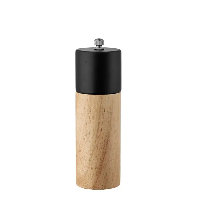 A sleek 6-inch manual wooden salt pepper grinder with a matte black top and silver knob by decorbites