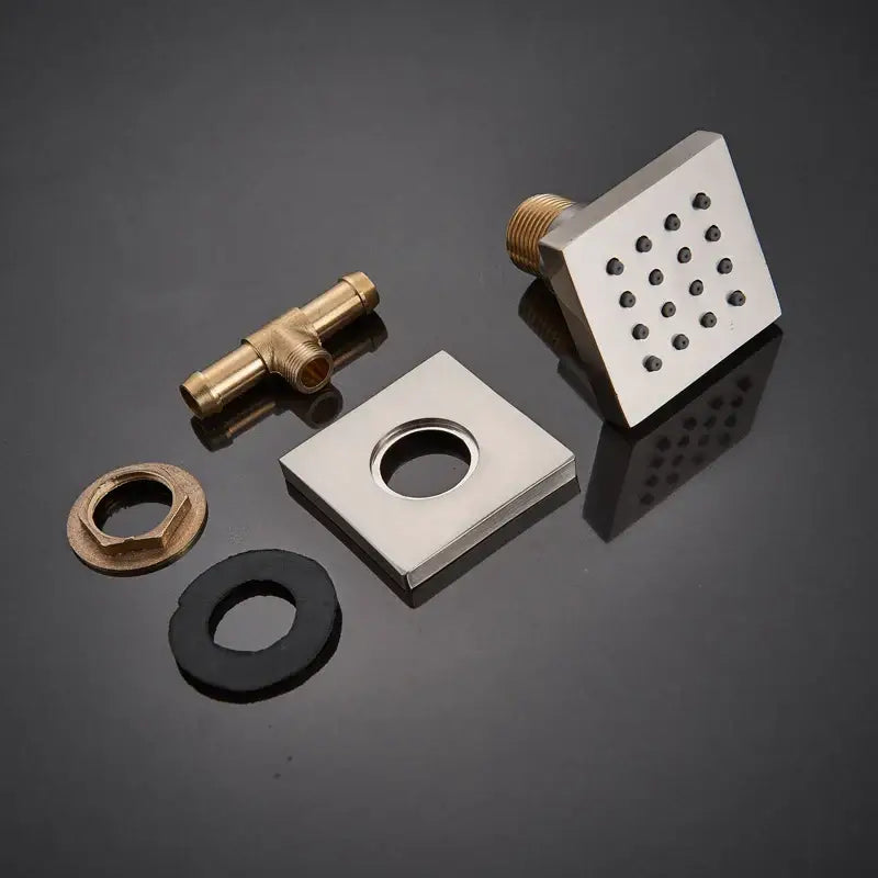 Square stainless steel shower head with a grid of small nozzles for shower massage jets in DecorBites™ 6-piece set