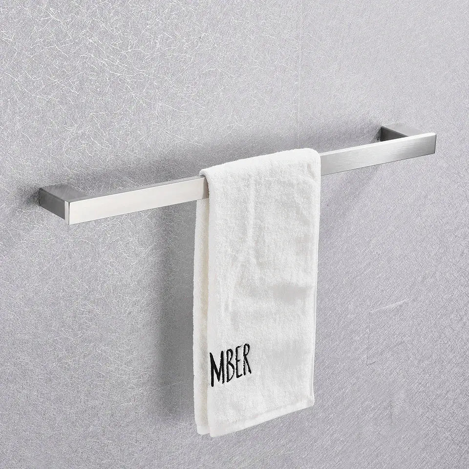 A sleek brushed nickel towel rack from the decorbites 6-piece bathroom accessories set with a white terry cloth towel