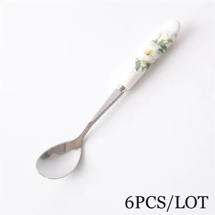 Decorbites™ coffee spoon set featuring elegant ceramic handles with yellow flowers and stainless steel bowls
